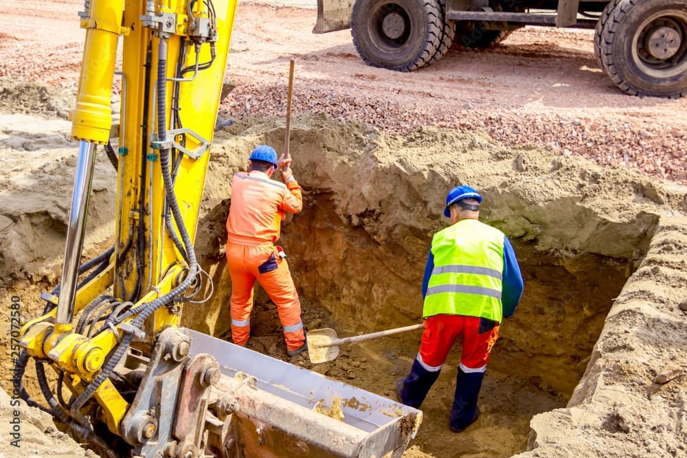 Works digging a hole in New Brunswick